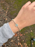 DIAMOND AND BLUE TOPAZ EYE BRACELET